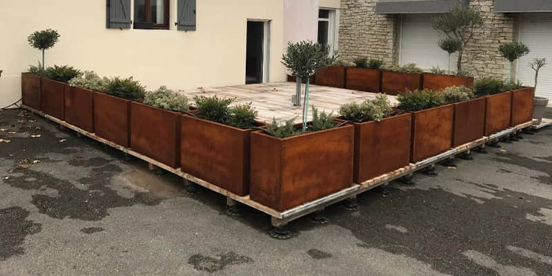 corten steel planter in yeard