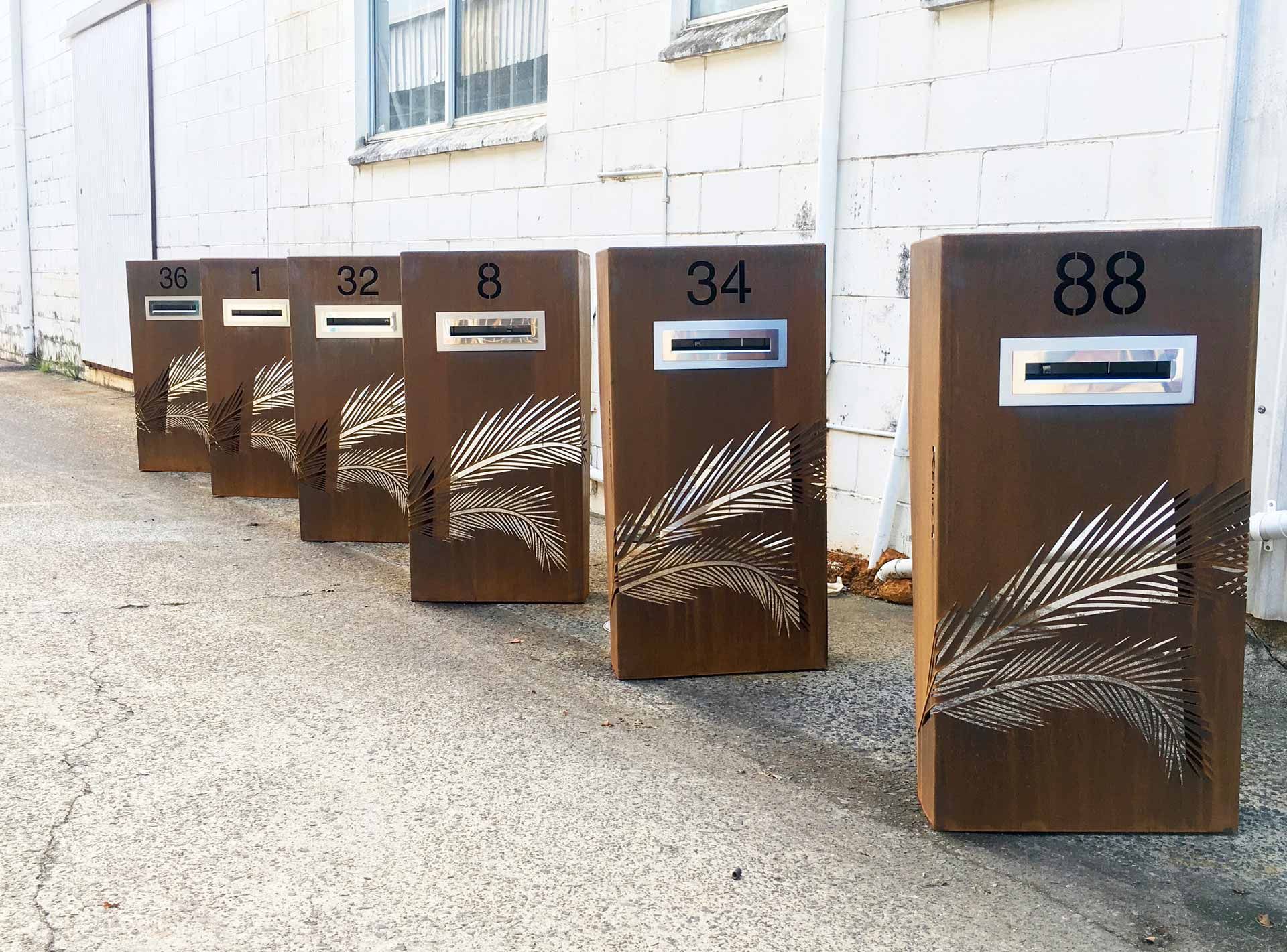 corten steel mailbox with number and patterns